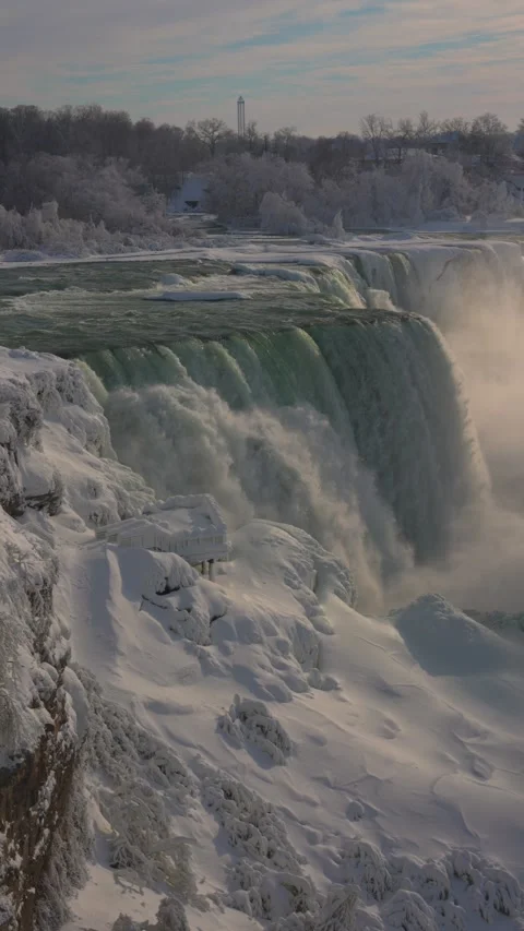 Vertical panorama of American Falls in winter with ice and blue water Stock-Footage 342331163