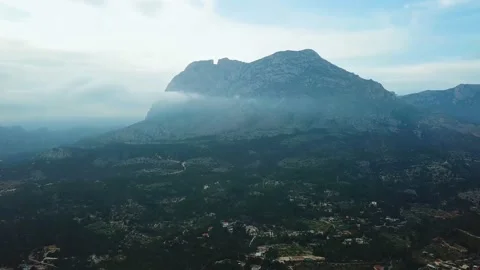 Vertical panorama of the mountain in the clouds Stock Footage 239656338