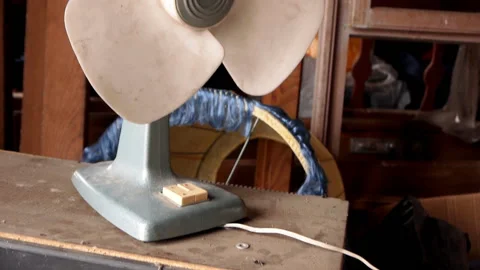 Vertical panorama of an old plastic fan in the attic Stock Footage 119785814