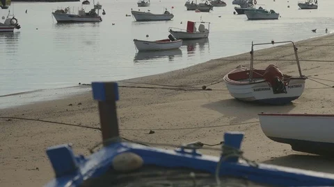 Vertical panorama pan from over a boat in Ferragudo, Portugal Stock Footage 80118897