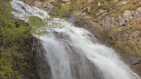 Vertical panorama of a waterfall in the mountains from top to bottom 스톡 동영상 78045439