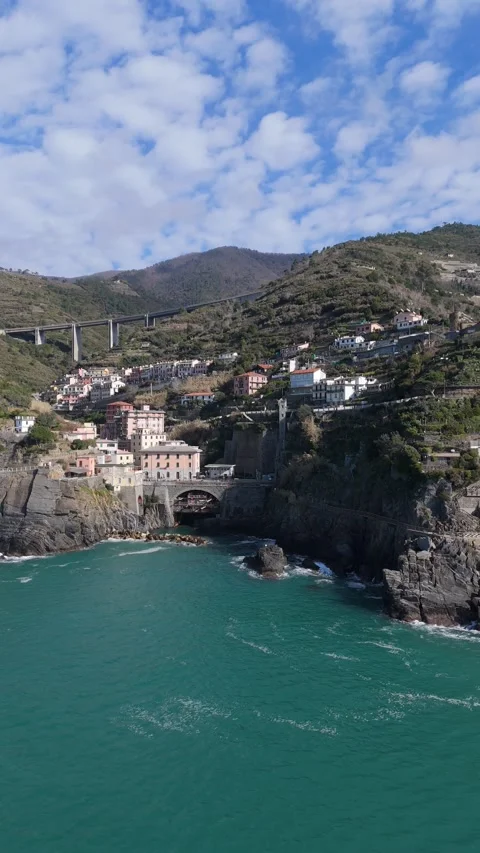 Vertical panoramic aerial of the Cinque Terre coastline in Italy Stock Footage 330740976
