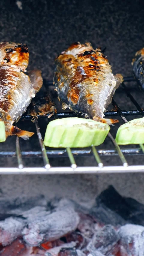 Vertical panoramic close-up video of cooking mackerel fish with vegetables. Stock Footage 338314143