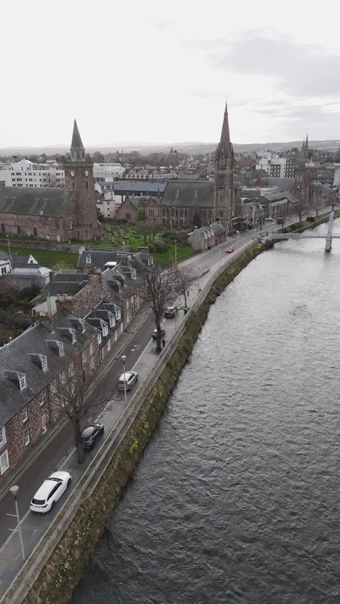 Vertical panoramic drone shot over Inverness during a cloudy day in the Stock-Footage 334951322