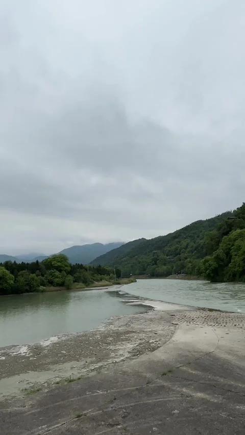 Vertical Panoramic View Of Historic Water Control Dike In Dujiangyan China Stockbeeldmateriaal 335256744