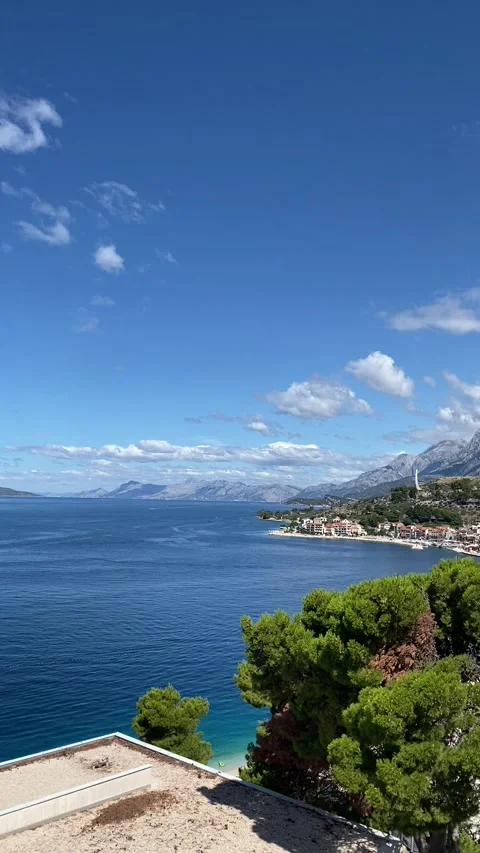 Vertical - Panoramic View Of Podgora Town Coast And Adriatic Sea Croatia Видео 345278019