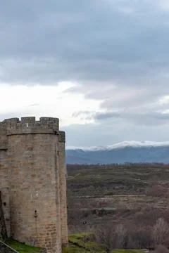 Vertical panoramic view of a stone castle tower in Puebla de Sanabria and sno Stock Photos