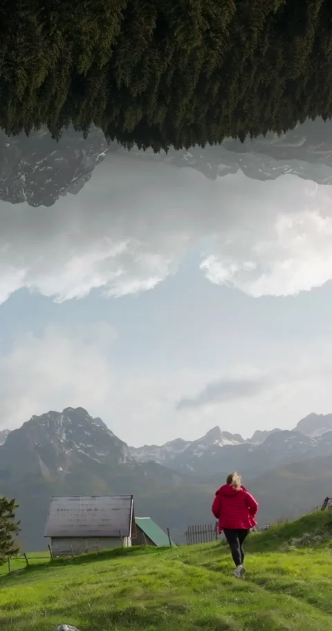 Vertical parallel dimension effect; woman run toward Montenegro sunset Stock Footage 277681312