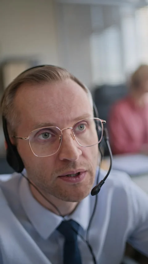 Vertical of Patient Operator Consulting Client via Headset in Call Center 스톡 동영상 335760193