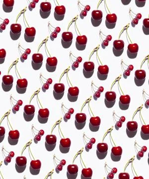 Vertical pattern of cherries with white background. Stock Photos