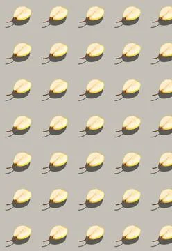 Vertical pattern with a fresh pear cut in half. Fruit template. Stock Photos