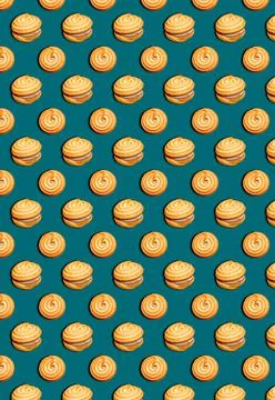 Vertical pattern with shortbread cookies on a green background. Pastry backgr Stock Photos