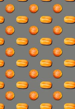 Vertical pattern with White loaves and rolls with sesame seeds on a grey back Stock Photos