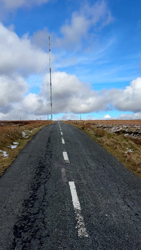 Vertical. Personal perspective walking road towards transmitting station mast Stock-Footage 329167335