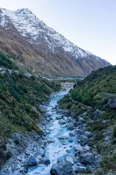 Vertical Perspective of Alaknanda River Flowing Through Rocky Himalayan Gorge Stock Photos