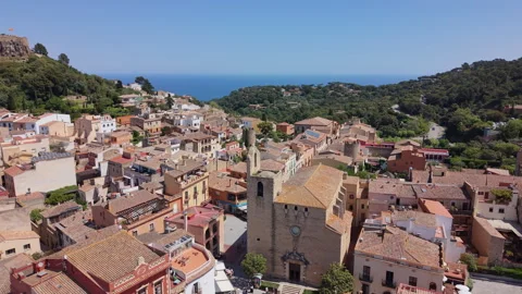 Vertical perspective of the central church and traditional stone architecture in Stock Footage 333773103