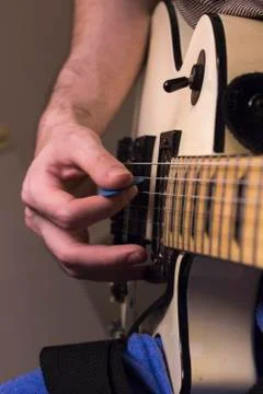 Vertical perspective guitar practice under the dim light Stock Photos