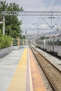 Vertical perspective shot of train station at suburban area Stock Photos