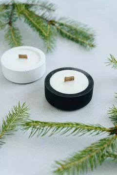 Vertical Photo of Black and White Candle Diagonally Among Christmas Tree Bran Stock Photos