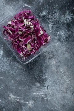 Vertical photo of chopped cabbage in plastic container Stock Photos