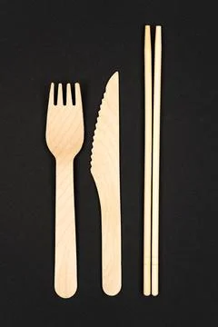 Vertical photo. Disposable tableware made of natural materials, knife Stock Photos