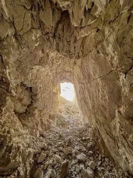 Vertical photo from inside an abandoned mining tunnel. Stock Photos