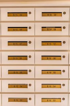 Vertical photo of mailbox array at postal room in apartment building Foto stock