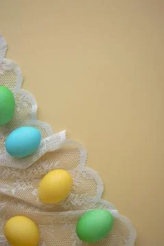 Vertical photo of painted Easter eggs on a lace background. Easter background Stock Photos