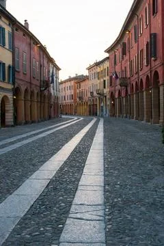 Vertical photo of a street with colorful edifices with white sky backgroun... Stock Photos