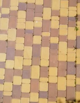 Vertical photo Surface texture of pavement with vivid rectangular tiles in .. 스톡 사진
