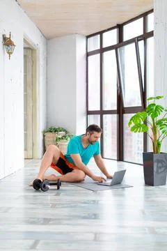 Vertical photo of a trainer explains to the client the specifics of training at Stock Photos