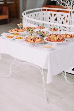 The vertical photo of the wedding table set consisted of meat dishes. Stock Photos