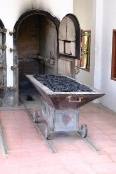 Vertical picture of sliding platform for placing coffins loaded with charcoal Stock Photos