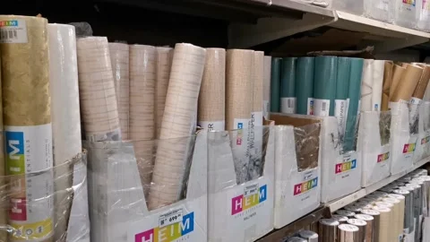 Vertical Pile of Wallpaper Rolls in a Shelf Stock Footage 170589540