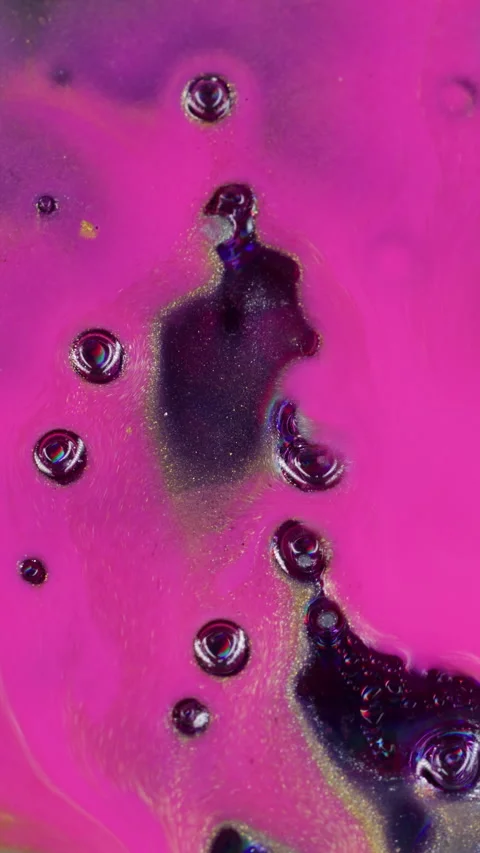 Vertical pink spill bubbles art glowing wet stream Stock Footage 334624043