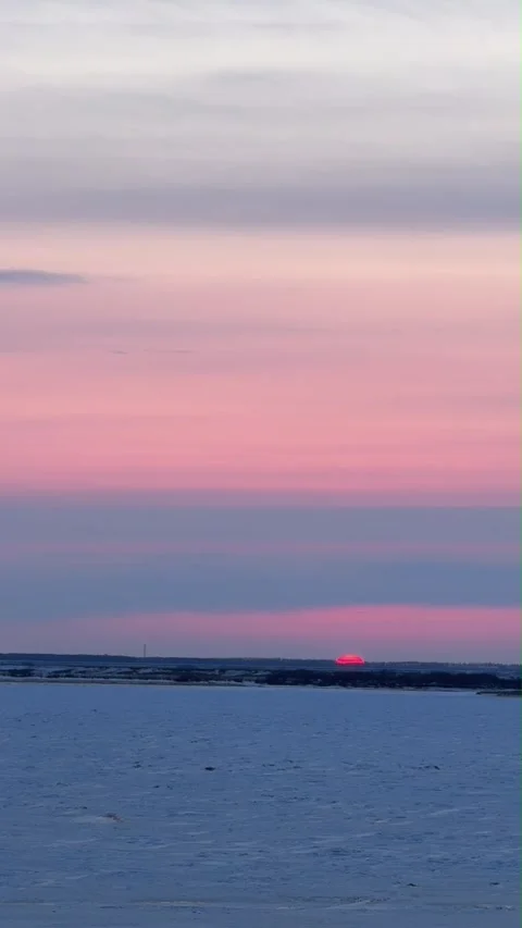 Vertical Pink Sunset Over Snow Covered Field Stock-Footage 333672420