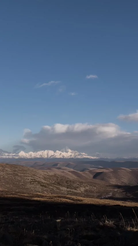 Vertical Plateau Snow Mountain Clouds Timelapse with Rolling Peaks Nature Vista Stock Footage 327479676