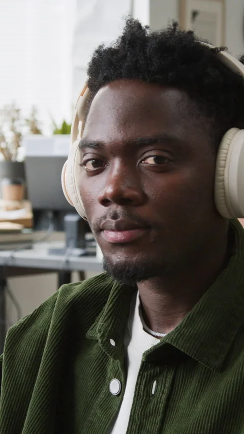 Vertical Portrait of Black Male Algorithm Developer in Headphones at Work Stock Footage 335937507