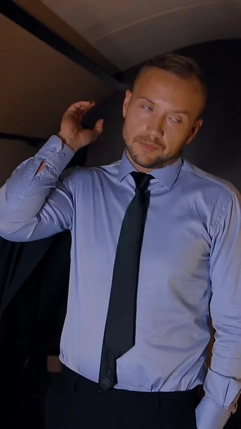 Vertical of Portrait of businessman throwing a jacket on his shoulder in private Stock Footage 277280328