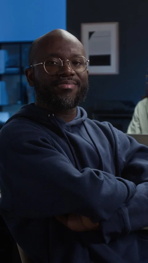 Vertical Portrait of Cheerful Black Young IT Specialist with Folded Arms Stock Footage 329618054