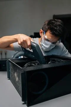 Vertical portrait of computer technician wearing protective mask and glasses Stock Photos