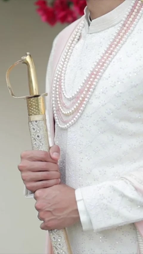 Vertical Portrait of Groom Posing in Traditional Wedding Attire Видео 337453104