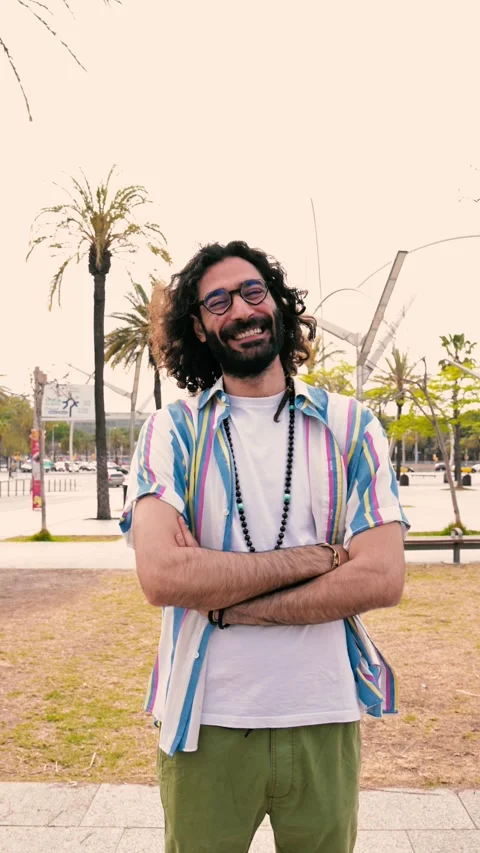 Vertical portrait of happy hipster guy smiling wearing a shirt looking at camera Stock Footage 247702974