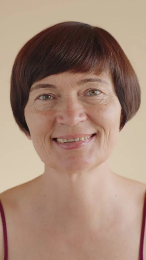 Vertical portrait Happy middle aged woman 50s old looking at the camera, smiling Stock Footage 281736801