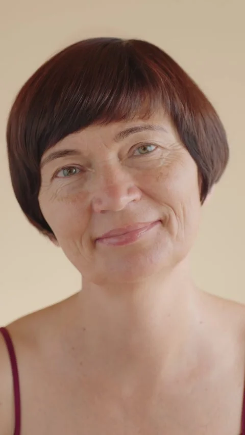 Vertical portrait Happy middle aged woman 50s old looking at the camera, smiling Stock Footage 281737219