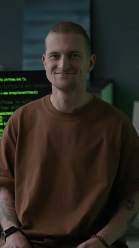 Vertical Portrait of Male Programmer in Office with Program Codes on Screen Video stock 292900670