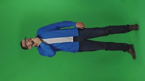 Vertical portrait of puzzled confused guy rubbing beard while thinking over Stock Footage 171924733