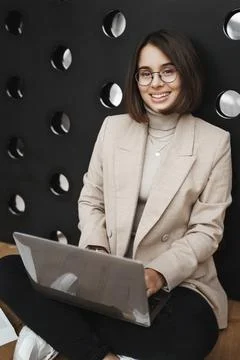 Vertical portrait of smart classy, good-looking woman in glasses and blazer Stock Photos