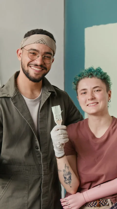 Vertical Portrait of Smiling Diverse Young Couple Renovating House Together Stock Footage 323297304