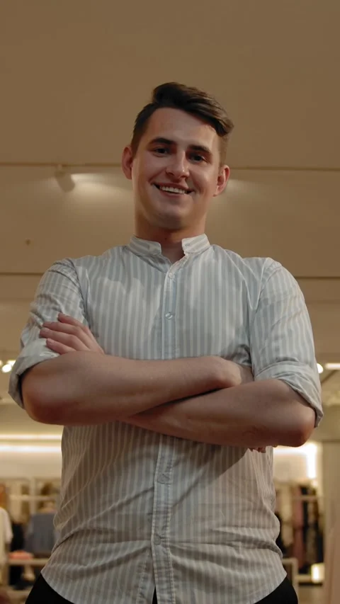 Vertical of Portrait of smiling man in summer shirt indoor of fashionable Stock Footage 276762901